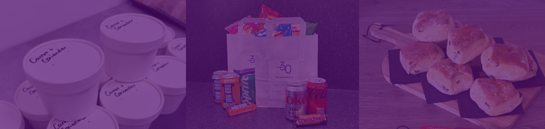 banner consisting of containers with soup, pre-made lunch bags with drinks, crisps, sandwiches and snacks and scones on a board